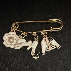 Elegant Gold Charm Brooch with White Accents
